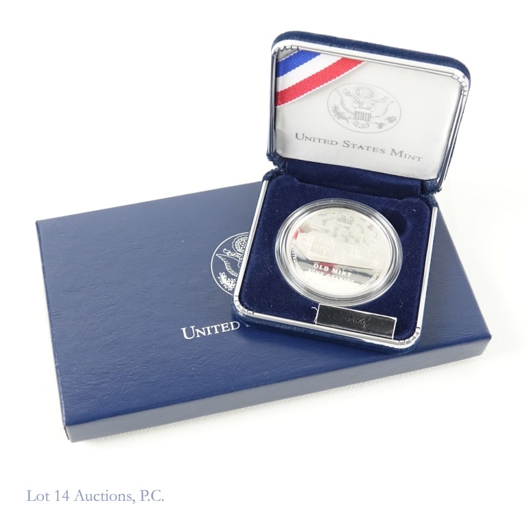 2006-S US Silver Proof Old Mint Com $1 in OGP: 2006-S United States silver proof San Francisco Old Mint in OGP with COA. Metal is 90%-silver and weighs 26.73 grams. Mintage is 160,870. ***Lot 14 Auctions is not a professional numismatic grading ag