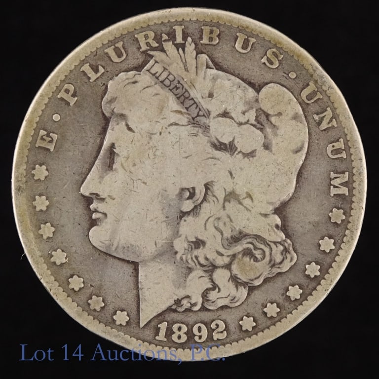 1892-S US Silver Morgan Dollar Semi-Key Date: 1892-S United States silver Morgan dollar (San Francisco Mint). Per Greysheet, "scarce in all grades". Metal is 90% silver. Mintage 1,200,000. *** Lot 14 Auctions is not a professional numismatic grad