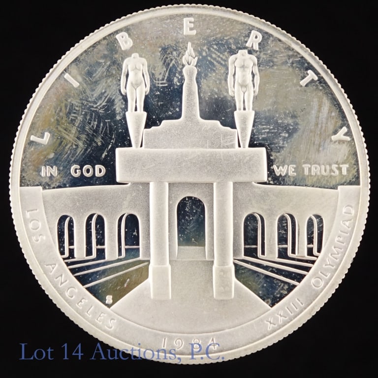 1984s US Silver Proof LA Olympics $1 (in OGP): 1984-S United States XXIII Olympiad coliseum silver dollar (San Francisco Mint) in OGP with "purchased at" sticker on box. Metal is 90% silver (ASW 0.7734 Ozt.). *** Lot 14 Auctions is not a professio