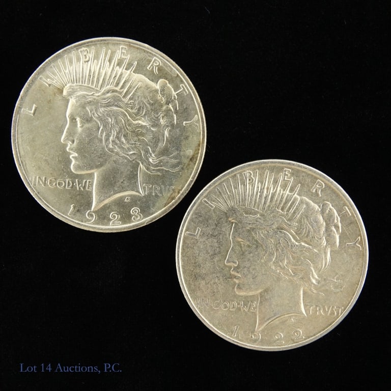 1922 & 1923 US 90%-Silver Peace Dollars (2): Two (2) United states silver peace dollars: ---1922 (P) and ---1923 (P). Metal is 90%-silver with ASW of 1.547 troy ounces. *** Lot 14 Auctions is not a professional numismatic grading agency. Consign