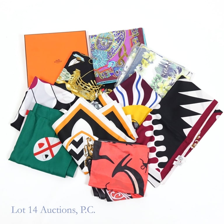 2 Hermes, Pinto Silk Scarves & 6 Other Scarves (9): 1 - Hermes 1572 Voiles De Lumiere Silk Black scarf, 35 x 35" with box. 2 - Hermes "Sous l'Egide de Mars" purple, maroon and turquoise silk scarf. 3 - Pinto silk scarf with floral design. 4 - Kitsch sc