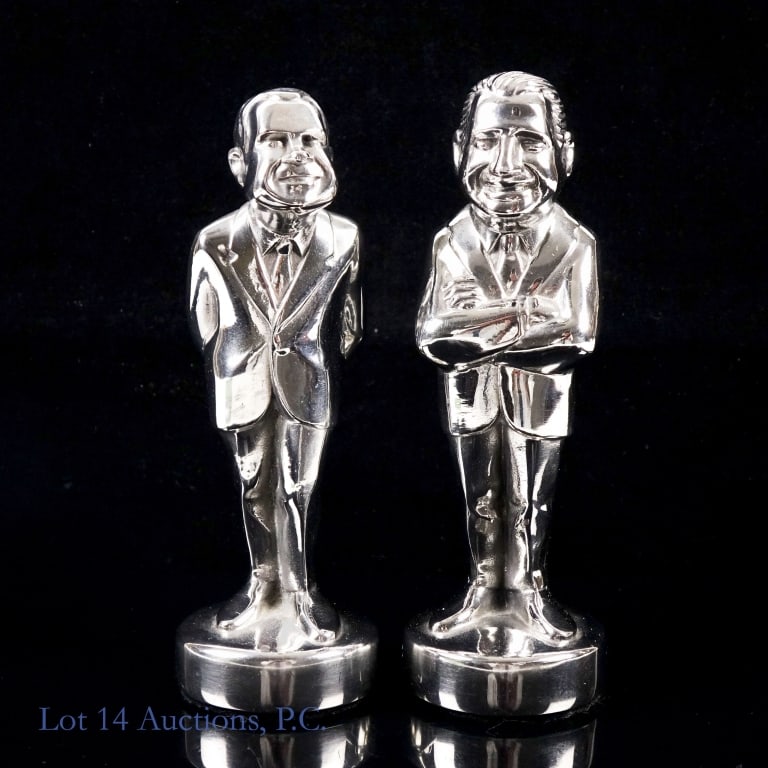 1971-73 Saari Richard Nixon & Agnew Metal Statues: Donald F. Saari statues of President Richard Nixon (dated 1971) and Vice President Spiro Agnew (dated 1973, #132). Approximately 5.5" tall, on 3" circular bases. Each weighs approximately 1.5Lbs. No d