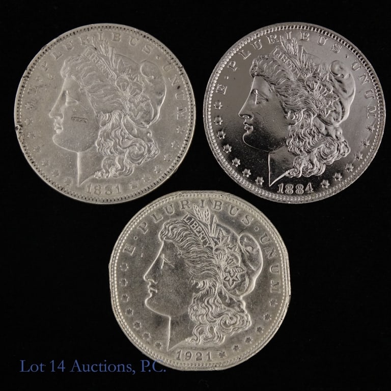 US 90%-Silver Morgan Dollars (ASW +2 Ozt), 3: Three (3) United States 90%-silver Morgan dollars as follows: ---1881 (P) , ---1884-O, and ---1921 (p). Coins cleaned and polished. Silver content conformed on Lot 14 Auctions electronic metal verifie