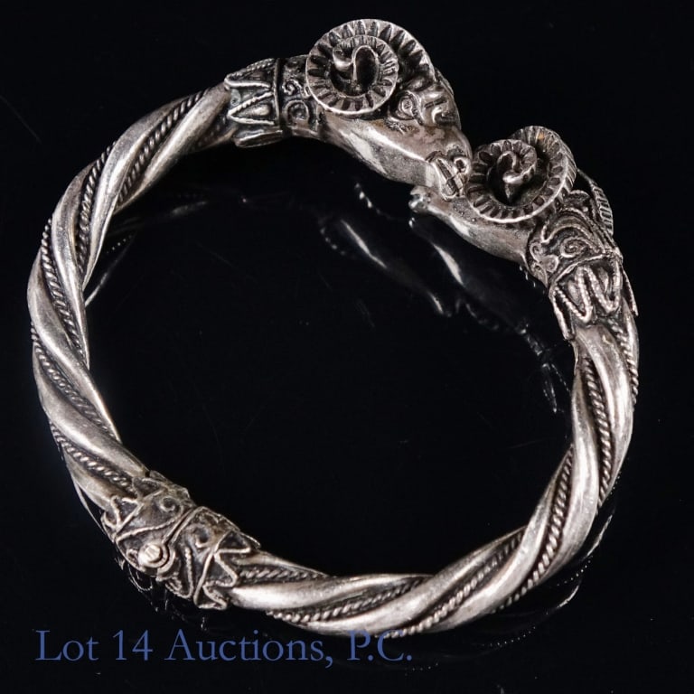 Sterling Silver Double Ram Head Hinged Bangle: Sterling silver double ram's head hinged bangls bracelet. Unmarked. Tests as 925 silver. 2.25" interior diameter at widest point. 43.2g (1.4 ozt).