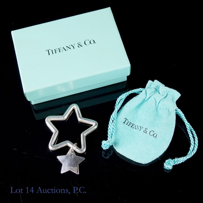 Tiffany & Co. Double Star Sterling Silver Keyring: Tiffany & Co. Double Star Sterling Silver Keyring. Never used, with original Tiffany bag and box. Approximately 1.75". Lot 14 guarantees the authenticity of this keyring.