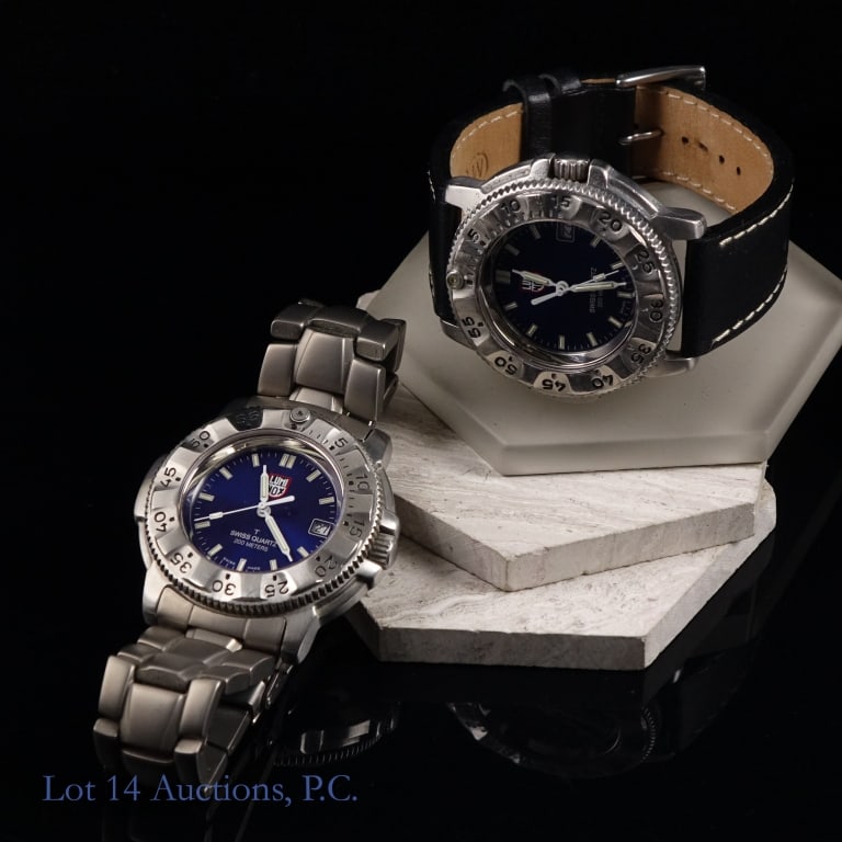 Luminox Navy Seals Steel 3200 Watches (2): Two (2) Luminox Navy Seals Steel 3200 watches. 45 mm wide stainless steel case with unidirectional bezel. Dark blue sunburst dial, white luminescent indices and hand, and 3 o'clock date window. One