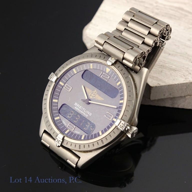 Breitling Navitimer Aerospace Titanium Watch: Breitling Navitimer Aerospace analog-digital watch. Titanium 40.5 mm case and original bracelet. Watch shows signs of wear but is in overall very good used condition for its age. See photos for