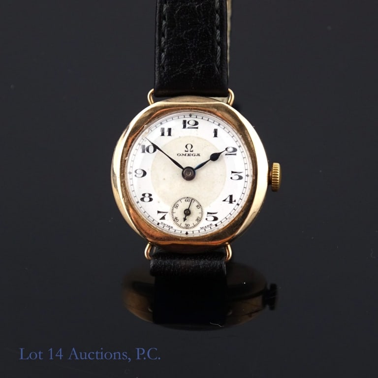 9k Y. Gold Omega Watch: 9k yellow gold vintage Omega Watch. Non-Omega leather strap. 26mm case diameter. Lot 14 guarantees the authenticity of this Omega watch. Watch is running, but has not been serviced or checked for