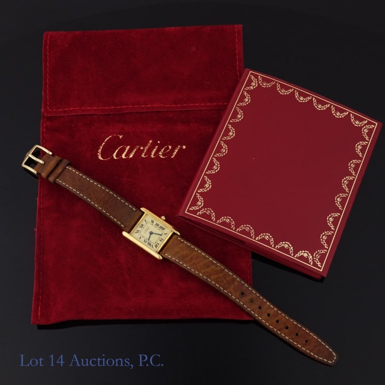 Cartier Gold Plated Tank Watch Champagne Dial: Cartier gold plated sterling silver (vermeil) tank watch, champagne dial. Watch case is 20.5mm wide, 20mm tall, 28mm lug-to-lug, 14mm lug width. With Cartier bag and booklet. Please see photos for