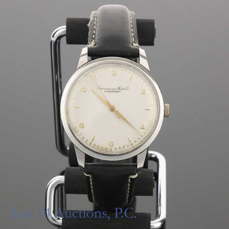 International Watch Co IWC Schaffhausen Watch: Men's International Watch Company (IWC) Schaffhausen watch. Ivory colored dial with gold (or gold tone) markers, numerals and hands. Dial is in very good condition. Stainless steel case has a 36mm