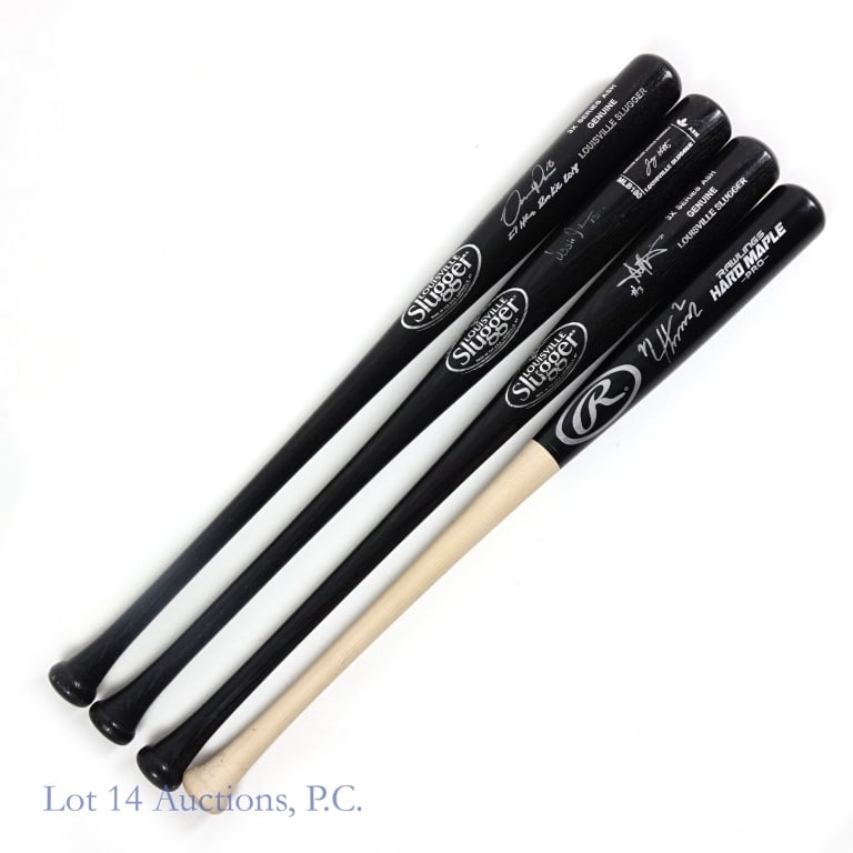 4 Signed Baseball Bats With Guillen and Baines: Four full size baseball bats each signed by a former White Sox player. Included in this collection is one bat signed by Ozzie Guillen and one signed by Harold Baines. There are two additional bats eac