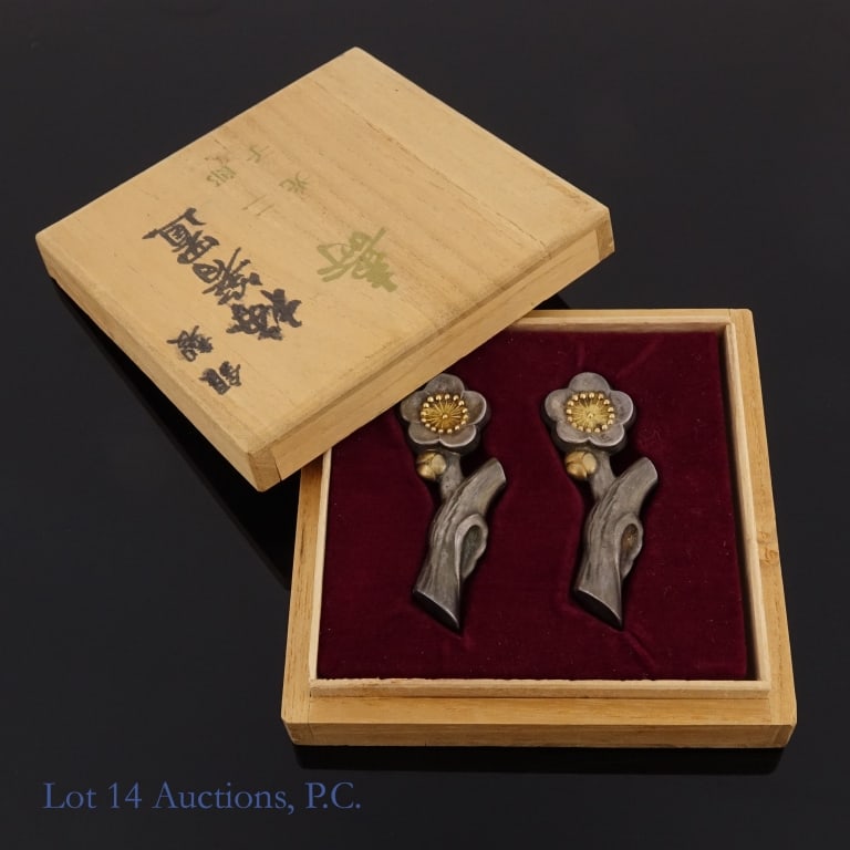 Pair of Chinese Sterling Flower Ornaments: Two small (approximately 2.25" long) ornaments shaped like a five petaled flower on a branch. Each has a pair of Chinese Hanzi on the backside. They chemically tested as sterling silver. Both pieces