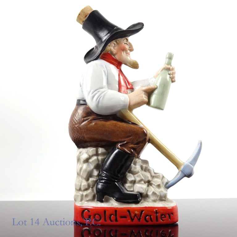 Gold-Water Miner Porcelain Liquor Flask / Bottle: Porcelain flask or bottle featuring a miner holding his own liquor bottle. Double sided image. Embossed "Gold-Water" on base. Approximately 6.5 x 4 x 1.35". No chips, cracks, repairs or damage