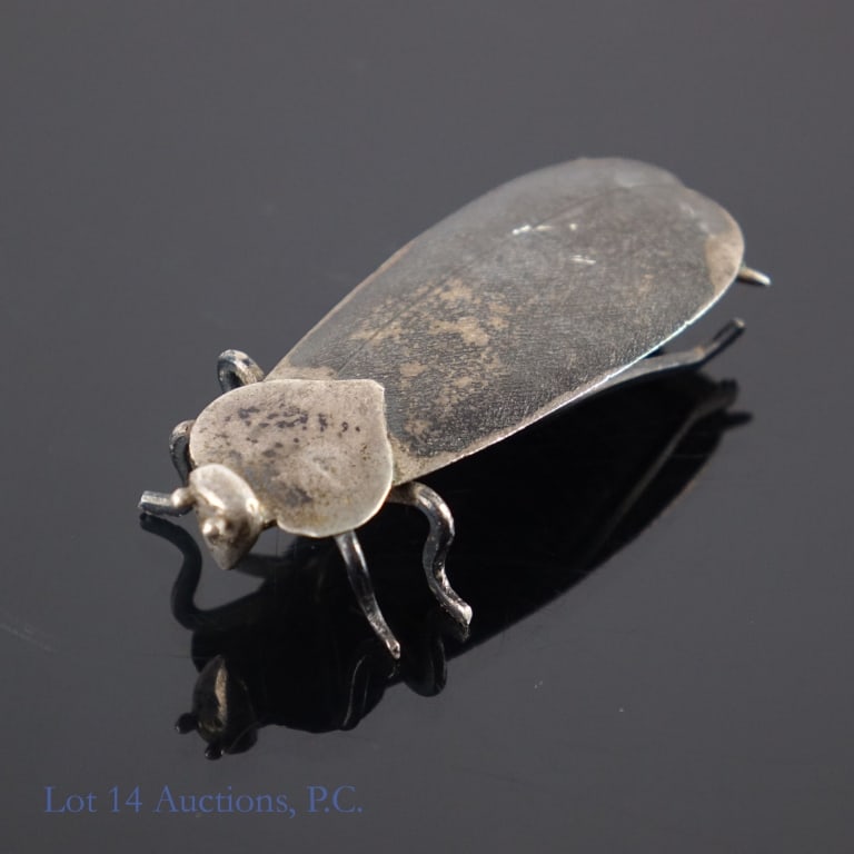 Japanese Sterling Silver Cockroach Ornament: Small table decoration shaped like a cockroach. The bottom of one of the wings has markings indicating that it is Japanese sterling silver. The bug likely had antennae at some point, but they have
