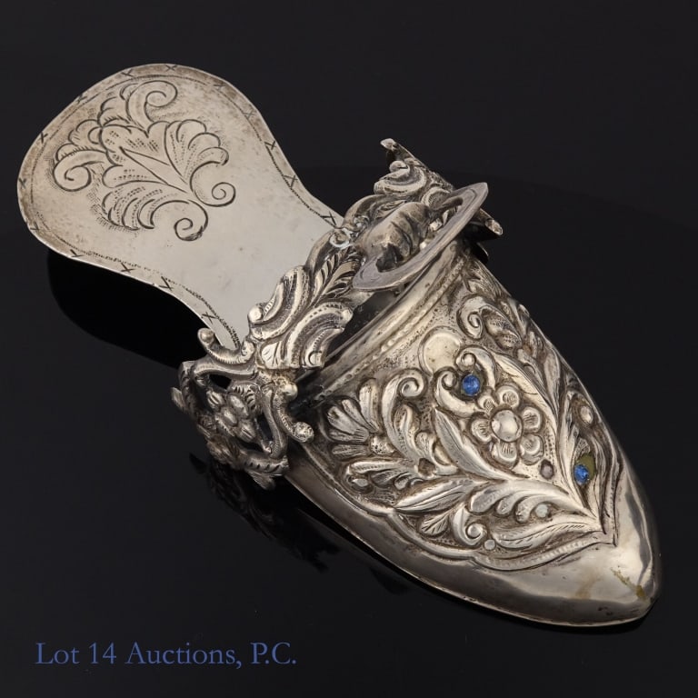 Peruvian Sterling Silver Riding Shoe: Peruvian sterling silver riding shoe. Two blue gem stones (of original eight) remain embedded. Approximately 9 x 3.75". 422 grams (13.568 troy ounces).