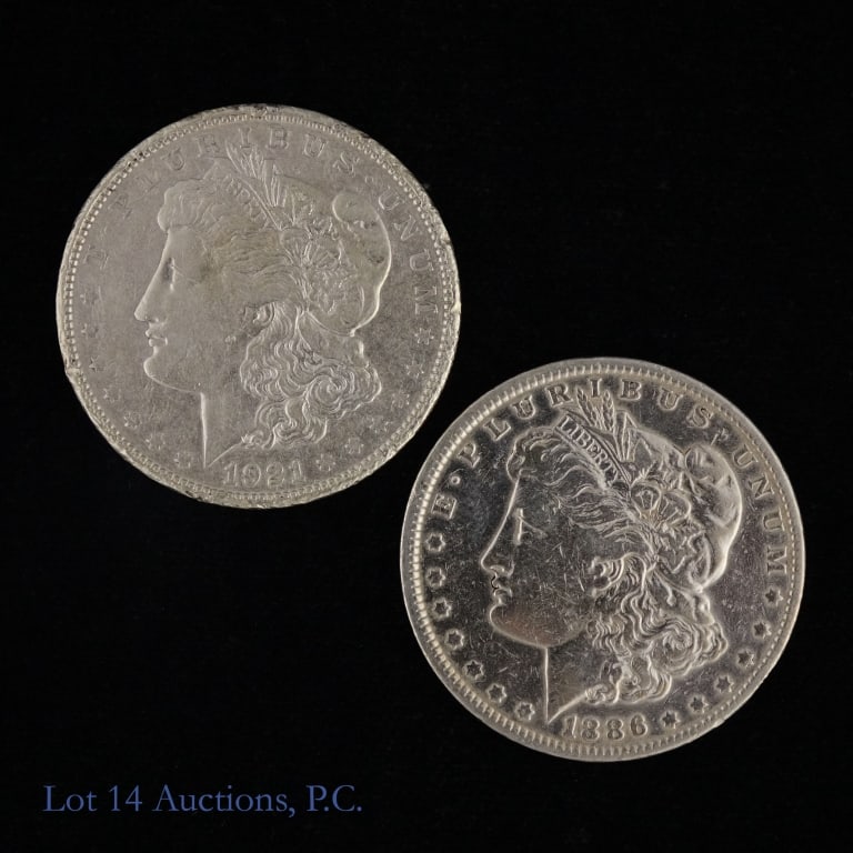 US 90%-Silver Morgan Dollars (ASW +1.4 Ozt), 2: Two (2) United States 90%-silver Morgan dollars as follows: ---1886 (P) and ---1921-D. Coins cleaned and polished. Silver content conformed on Lot 14 Auctions electronic metal verifier and lot weighs 