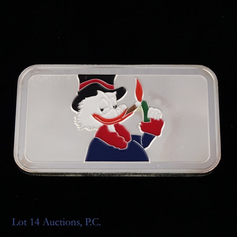 SB 99.9%-Silver 1 Ozt. Ingot: Colorized scrooge McDuck-like SB 99.9% silver one troy ounce silver ingot. Silver content confirmed on Lot 14 Auctions electronic metal verifier. *** Lot 14 Auctions is not a professional numismatic g