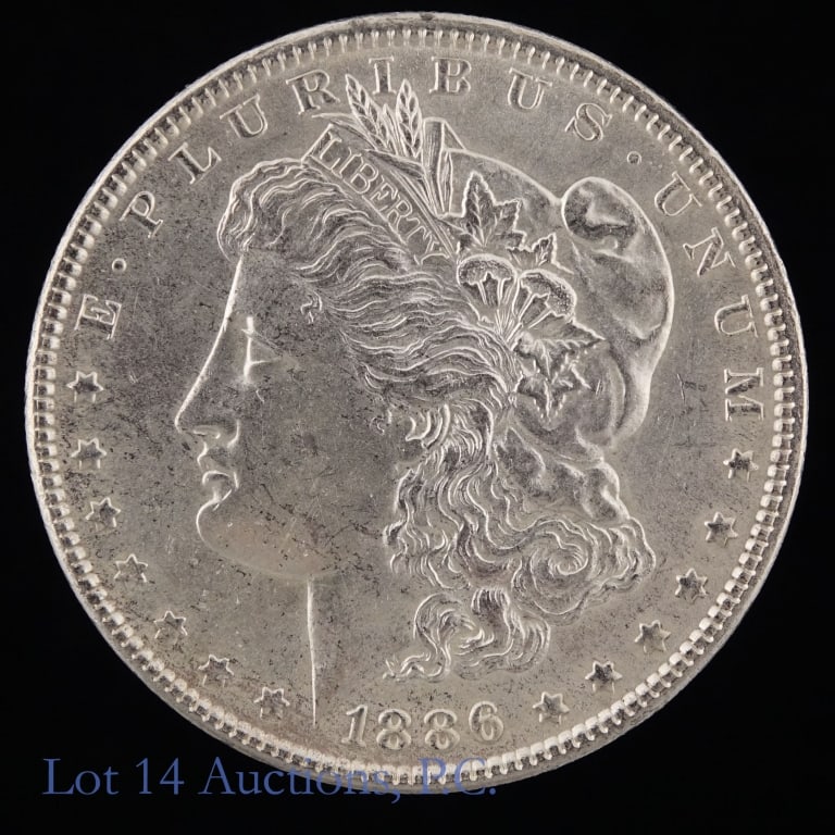 1886 (P) US Silver Morgan Dollar: 1886 (P) United States silver Morgan dollar (Philadelphia Mint). Per consigner, fairly clean fields and still has some original luster. Metal is 90% silver (ASW = 0.7734 ozt.) *** Lot 14 Auctions is n