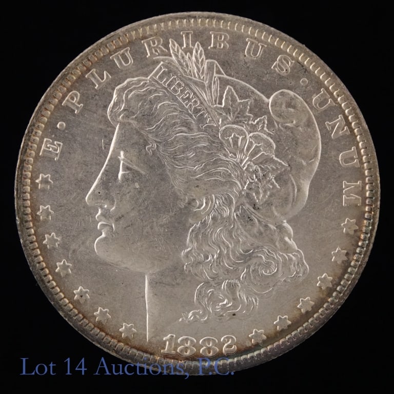1882-O US 90%-Silver Morgan Dollar: 1882-O United States silver Morgan dollar (New Orleans Mint). *Per consigner, better date with some original luster. Metal is 90% silver with ASW 0.7734 troy ounces. Mintage 6,090,000. *** Lot 14 Auct