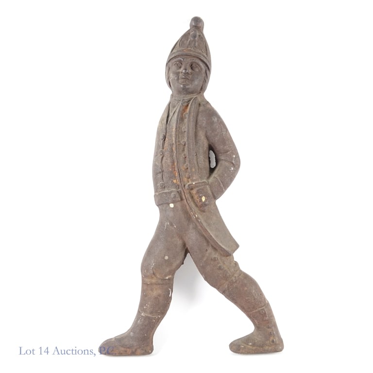 Single Cast Iron Hessian Soldier Andiron: Lone cast iron Hessian Soldier andiron for a fireplace. Even patina, fairly good condition. Measures approximately 20 x 11 x 2".