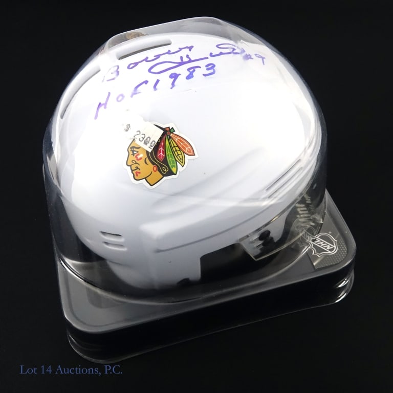 Bobby Hull Signed Blackhawks Mini Helmet: *** This lot is sold "as is" with no COA or guarantee. *** SportStar white Chicago Blackhawks mini ice hockey helmet. Signed on top in blue sharpie by Bobby Hull and inscribed "#9" and "HOF 1983".