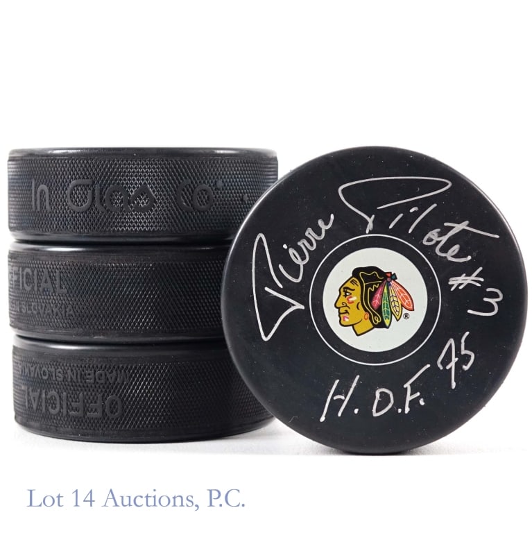 Blackhawks Chelios Hull Esposito Pilote Pucks: Four pucks signed by former Blackhawks who are members of the NHL HOF. The players represented in this group are Chris Chelios with PSA sticker (cert number AK23086) *** Tony Esposito with PSA