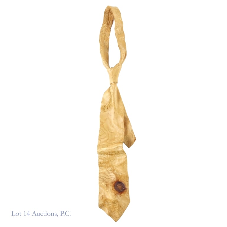 Livio De Marchi Hand Carved Wooden Tie: Life size sculpture of a necktie carved from a single piece of pine wood by Italian artist Livio De Marchi, born 1943. Artist signed his name on the backside of the piece. There is a small chip in