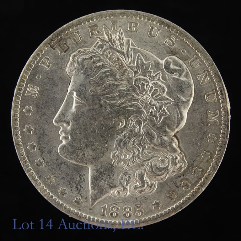 1885-O US Silver Morgan Dollar (*BU): 1885-O United States silver Morgan dollar (New Orleans Mint). *Per consigner, in BU condition from an original bag. obverse has abrasions from being put in a bag, but the coin is uncirculated. Metal