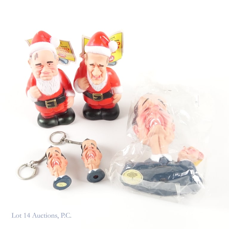 Spitting Image Bush Sr. Caricature Items (5): Spitting Image Bush Sr. Caricature Items (5). 5 caricature pieces from spitting image, 2 George H. W. Bush keychains, 1 George H. W. Bush squeaky toy, 1 George H. W. Bush Glasnost Christmas, and 1 Mik