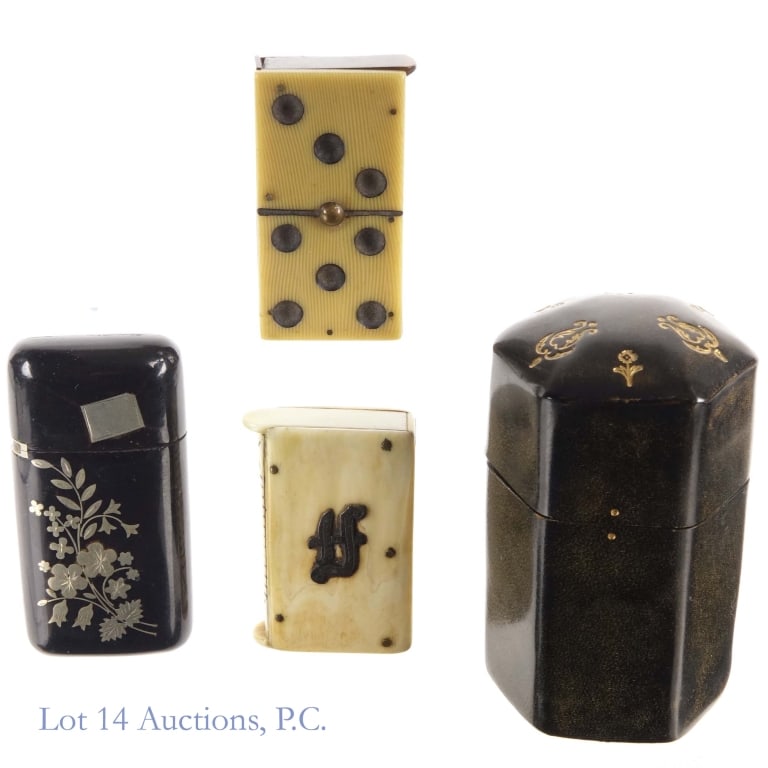 Antique Vesta Cases / Match Safes: Four antique vesta cases or match safes made from various materials, dating from the late 19th or early 20th century. The first is in the shape of a domino, made from vulcanite and celluloid dating
