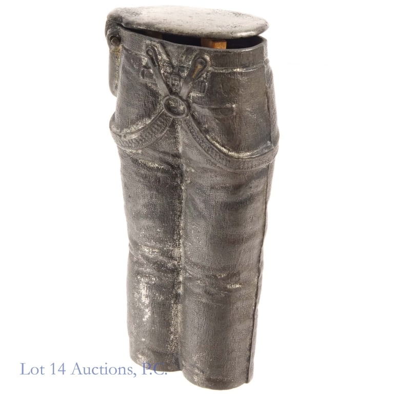 1886 "Pants Safe" Vesta Case / Match Safe: 1886 sculptural pewter vesta case or match safe made to look like a pair of work pants. It was termed the "Pants Safe" in the Zorn catalogue in the 1880s. The pin on the lid is broken on one side.