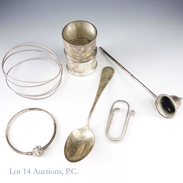 Various Sterling Silver Jewelry, Tableware: Group of sterling silver accessories, tableware and a golf keychain. Includes two bracelets, two napkin rings, a golf keychain, a spoon, and a candle snuffer. All are marked as sterling except the