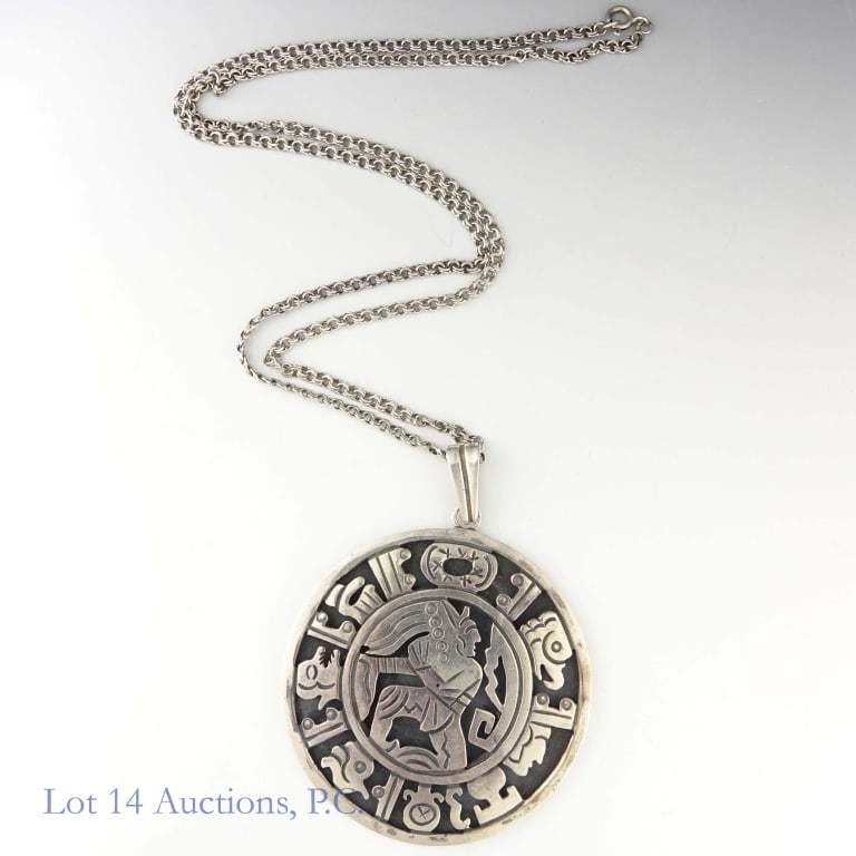 Mesoamerican Style Sterling Silver Medallion: Sterling silver medallion with a Mesoamerican style design on the front. Text on the back of the medallion reads "Sterling 925" and "Hecho en Mexico". On a 27.5" long sterling chain. Weighs