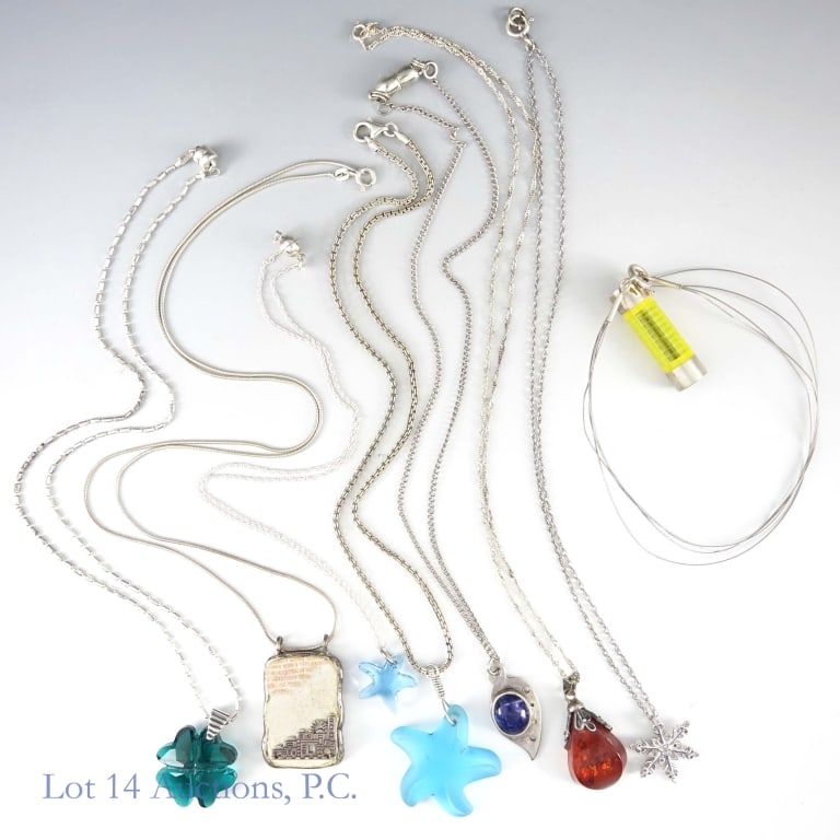 Sterling Silver Necklaces (8): Lot of 8 sterling silver necklaces with pendants. Total weight is approximately 64.72g or 2.08 troy oz.