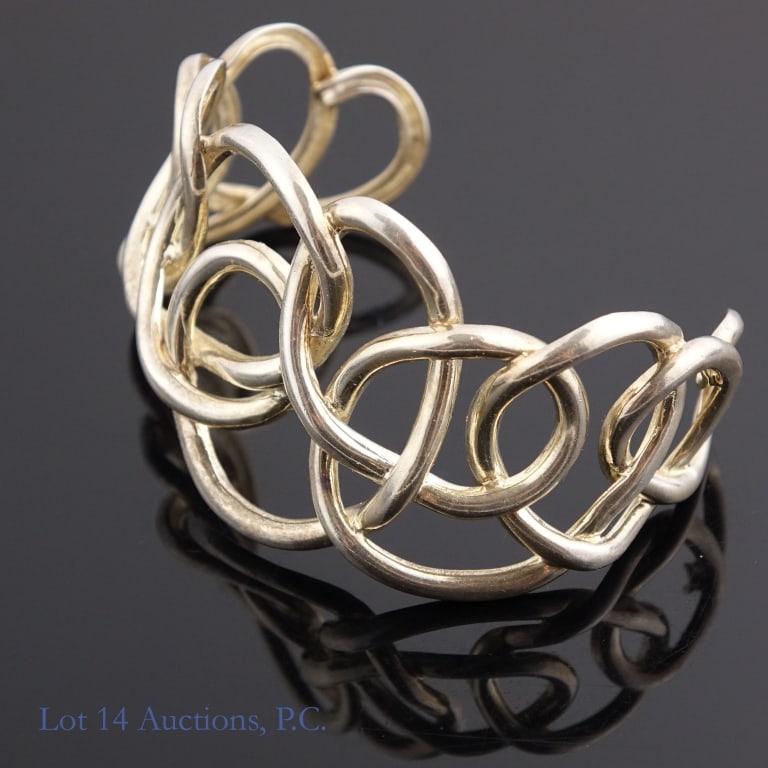 Angela Cummings Sterling Silver Cuff Bracelet: Sterling silver Knotted Loop cuff bracelet by designer Angela Cummings. Marked 925 and AC Studios on the inside. Weighs approximately 50g or 1.6 troy oz.