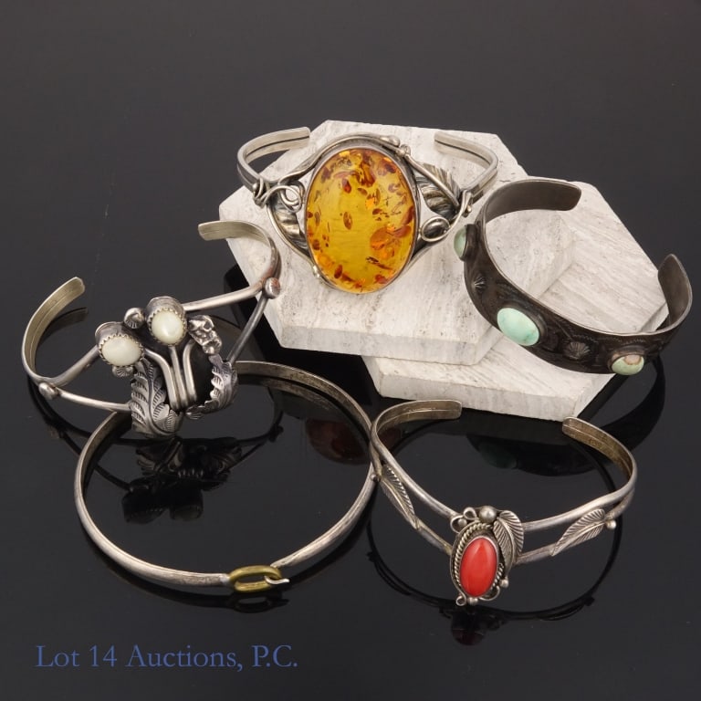Sterling Silver Cuff Bracelets (5): Five (5) sterling silver cuff bracelets with amber, turquoise, and coral. Approximately 86 g - 2.77 ozt total weight. See photos for details.