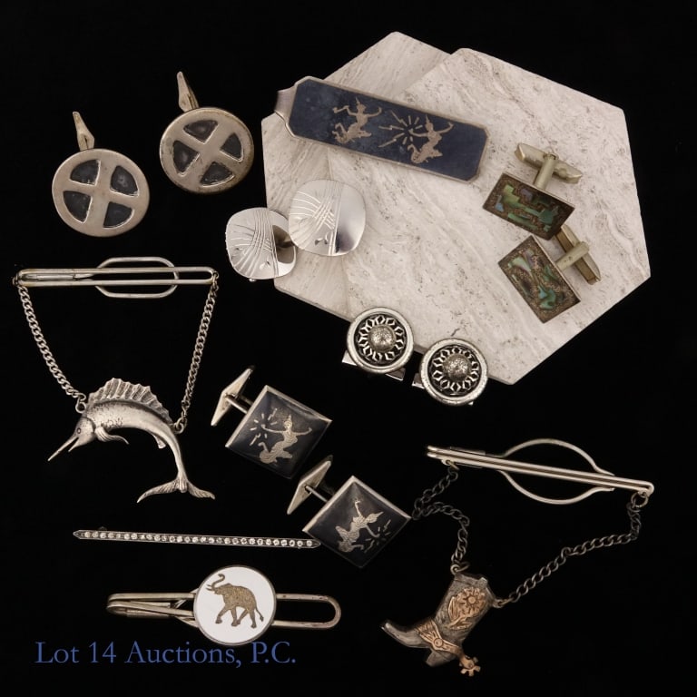 Sterling Silver Cuff Links And Tie Clips* (5+5): Five (5) pairs of sterling silver cuff links and five (5) sterling silver tie clips. Approximately 100 g - 3.22 ozt. *The clips on swordfish and cowboy boot tie clips are not sterling.