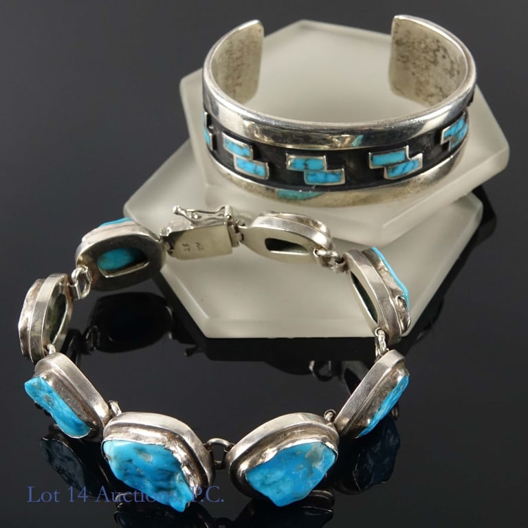 Silver and Turquoise Bracelets (2): Two Sterling silver and turquoise bracelets. Bracelet with rough cut stones and links is approximately 8", 2.15ozt. (67g) and is signed A.F. 925. Cuff is and 2.3ozt (71.6g), inside diameter is