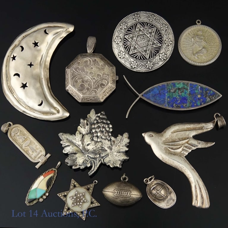 Sterling Silver Pendants & Brooches Lot: Lot of sterling silver pendants and brooches. Two are not marked as sterling but passed an acid test. 12 pieces in total, weighs approximately 93.49g or 3 troy oz.