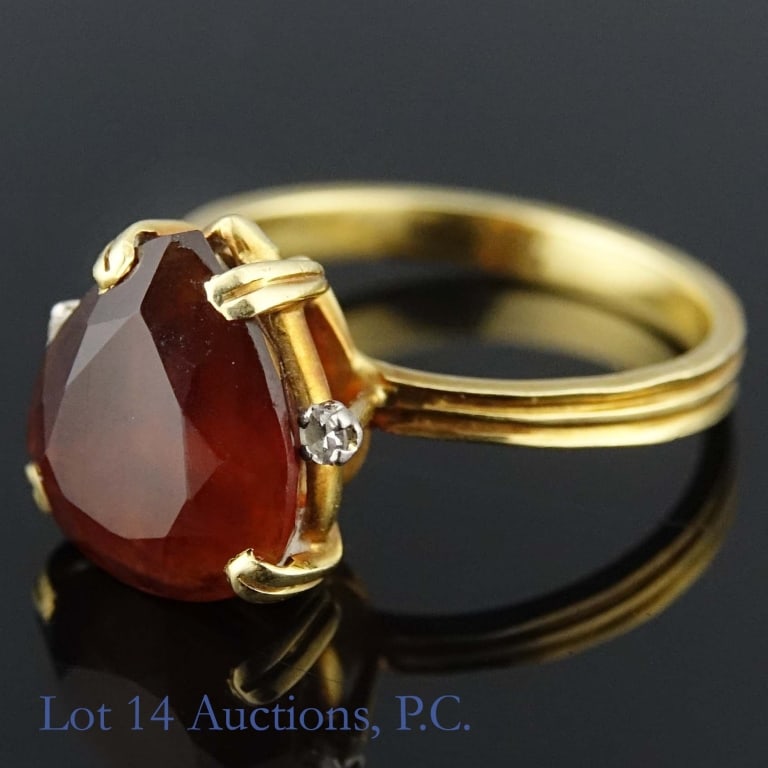 18k Gold & 950 Platinum Ring: Size 7 ring made from 18k yellow gold and 95% platinum. The inside of the ring has the numbers "950" and "750". Holds a brown stone, possibly citrine, hessonite, or some kind of quartz, along with one
