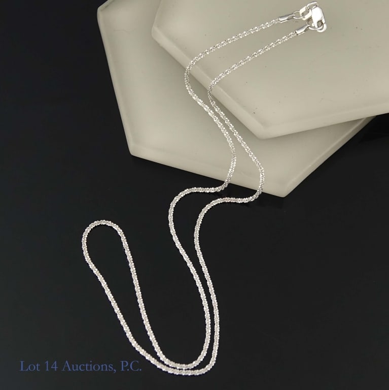 14k White Gold Chain: 16.25" chain made from 14k white gold. Marked "14KT" and "Italy" on the the clasp. Weighs approximately 2.57g or 0.08 troy oz.