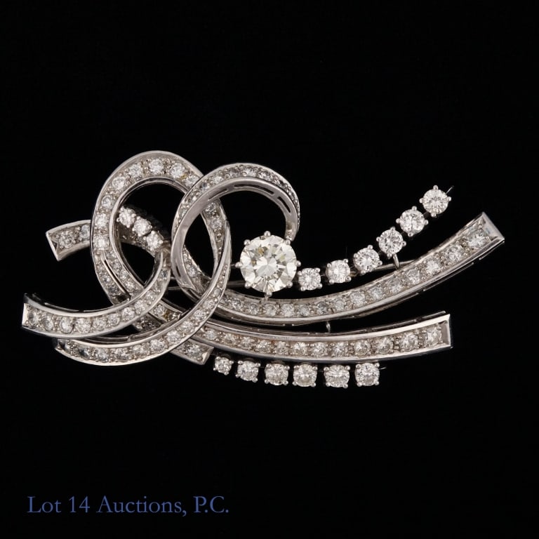 Platinum & Diamonds Ribbon Brooch +4 Ct TW: Platinum ribbon brooch with diamonds. Main 1.5 Ct diamond, more than 4 Ct total weight. Approximately 2.6" X 1.2". Approximately 26.23 g - 0.844 ozt total weight.