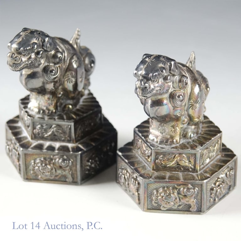Chinese Silver Foo Dogs Salt & Pepper Shakers: Chinese silver salt & pepper shakers made to look like foo dogs. Total weight of both shakers is approximately 71.85g or 2.3 troy oz. Each stands approximately 2.5" tall.