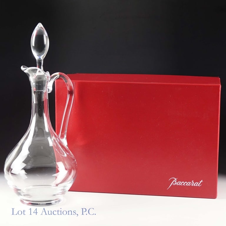 Baccarat Oenologie Handled Decanter (NOS): Baccarat crystal Oenologie handled decanter. Believed to be approximately 750 ml. New-Old Stock in original Baccarat red box. Stopper included. Height approximately 10.25" (without stopper). Height