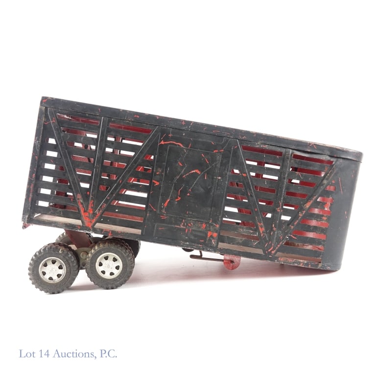 Dunwell Pressed Steel Trucks & Trailers: Two (2) 1950s Dunwell pressed steel trucks and one (1) Dunwell pressed steel trailer. Both trucks appear to be repainted. The trailer also appears to be repainted. One of the support wheels on the