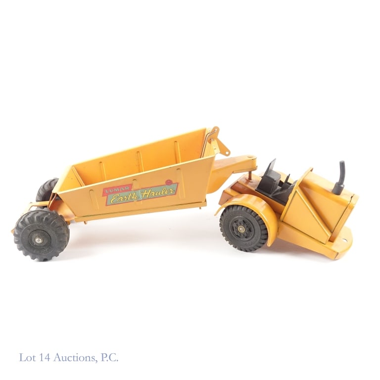 1950s Marx Lumar Earth Hauler: 1950s Marx pressed steel Lumar Earth Hauler (2 pieces). Dumper mechanism works. Some dirt and light wear. Some oxidation on rear of hauler. Approximately 19" long (both pieces connected).
