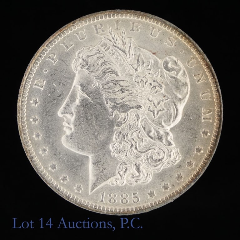 1885-O US Silver Morgan Dollar: 1885-O United States silver Morgan dollar (New Orleans Mint). *Per consigner, with light obverse and edge toning with decent luster in BU condition. Metal is 90%-silver (ASW 0.7734 ozt.). Per Greyshee