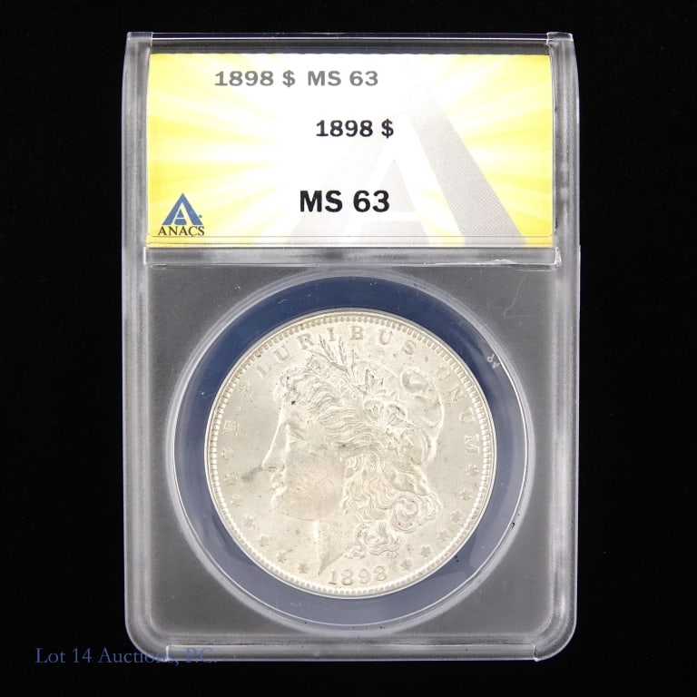 1898 US Silver Morgan Dollar (ANACS MS63): 1898 (P) United States silver Morgan dollar (Philadelphia Mint). ANACS graded MS 63. Metal is 90% silver. Mintage 5,884,000. ***Lot 14 Auctions is not a professional numismatic grading agency. Consign