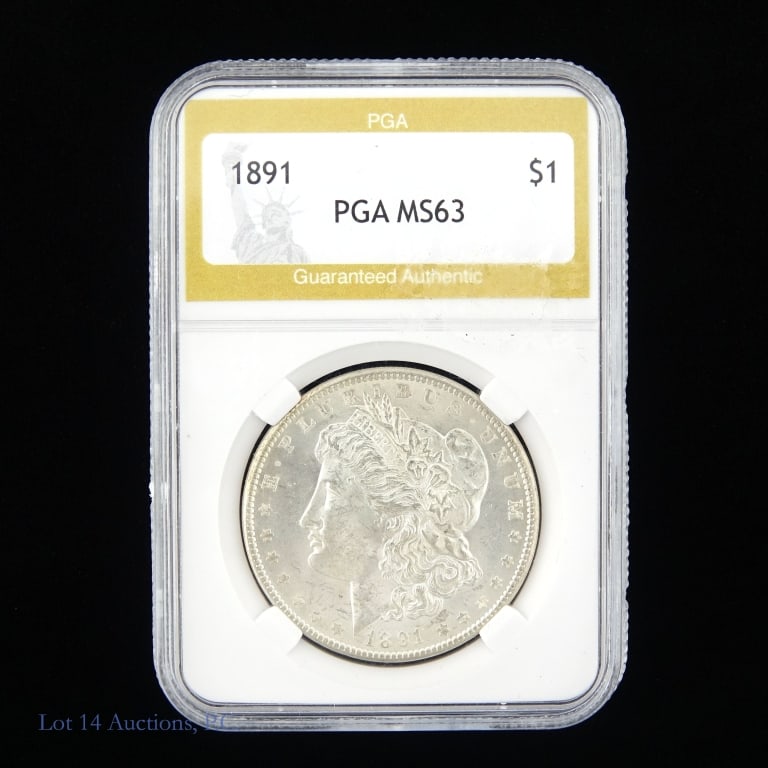 1891 (P) Silver Morgan $1 (PGA MS63): 1891 (P) United States silver Morgan dollar (Philadelphia Mint). PGA slabbed MS63. Metal is 90% silver. Mintage 7 million. Silver content confirmed on Lot 14 Auctions electronic metal verifier. ***Lot