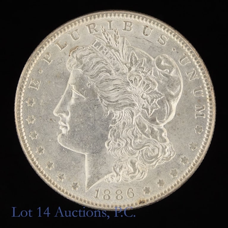 1886 (P) US Silver Morgan Dollar (*Decent Luster): 1886 (P) United States silver Morgan dollar (Philadelphia Mint). *Per consigner, has decent luster. Metal is 90%-silver (ASW 0.7734 ozt.). *** Lot 14 Auctions is not a professional numismatic grading 